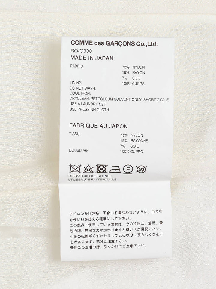 Cream sleeveless Comme des Garçons Comme des Garçons dress in raised floral jacquard with a fitted bodice and pleated skirt - view 3