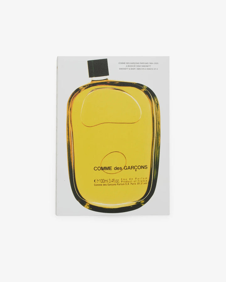 Cover of the Comme des Garçons Parfums 1994–2025 book by Dino Simonett, showing a close-up of an amber Eau de Parfum bottle on a pale grey background