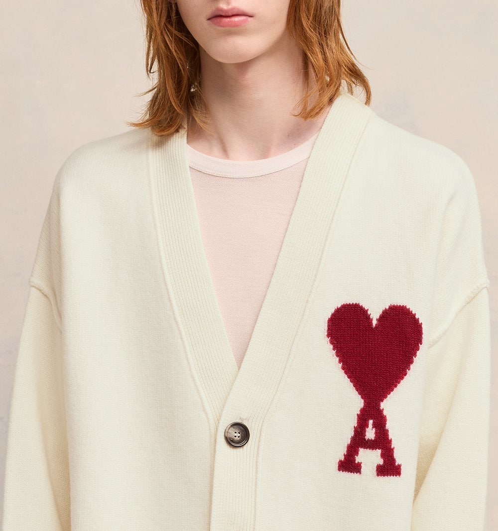 AMI de Coeur cream knit cardigan with red intarsia heart-and-A logo on chest, V-neckline and button front closure