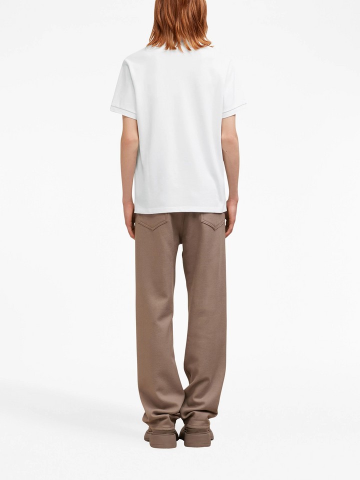 AMI De Coeur white polo shirt with red heart-A logo embroidery at the chest, front view
