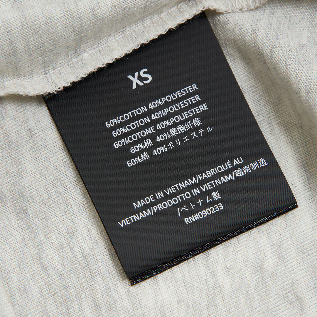 Fear of God Essentials Women's Signature Classic Tee in heather grey marl with crew neckline and short sleeves