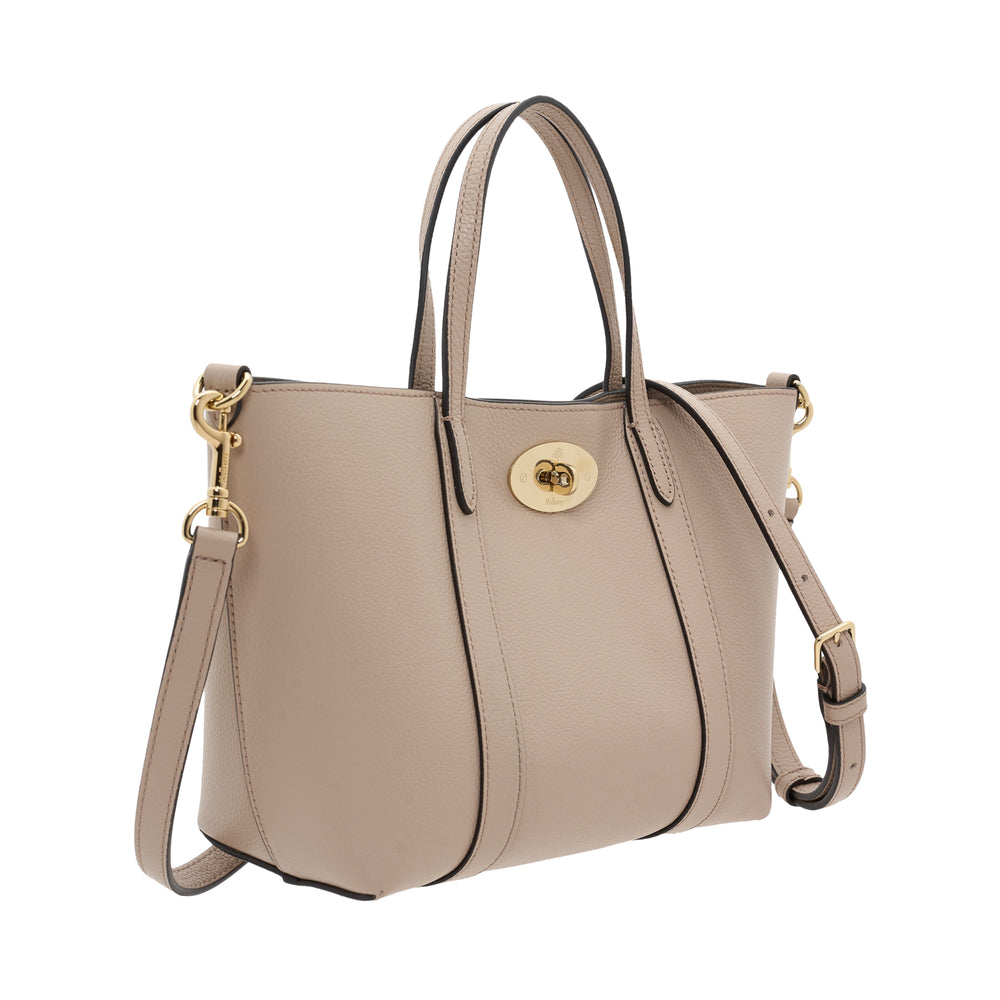 Mulberry Mini Bayswater Tote in pebbled taupe leather with gold-tone postman's lock closure, dual top handles and a detachable adjustable crossbody strap