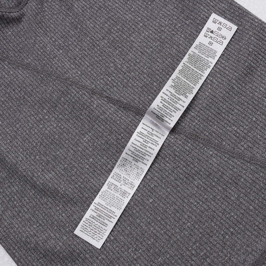 rag & bone Essential Rib Heather Tank in heathered grey, featuring a high racerback neckline and slim ribbed knit construction, shown on a white background