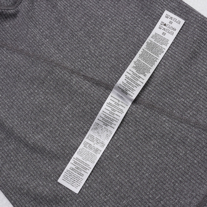 rag & bone Essential Rib Heather Tank in heathered grey, featuring a high racerback neckline and slim ribbed knit construction, shown on a white background