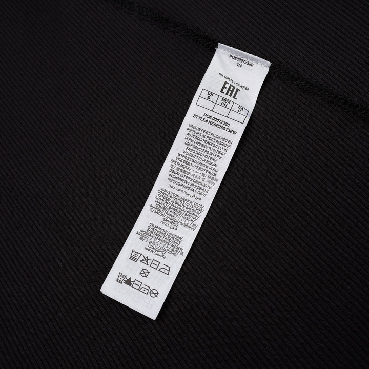 rag & bone Essential Rib Muscle Tank in black, featuring a high racer neckline, fine ribbed knit fabric, and a form-fitting sleeveless silhouette, shown on a flat lay against a white background - view 3