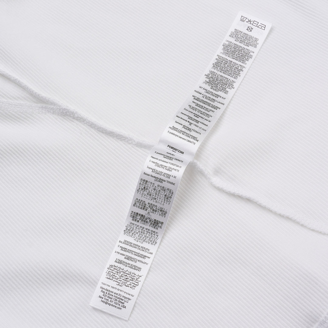 rag & bone Essential Rib Long Sleeve Crew in white, featuring a slim ribbed silhouette, elevated crew neckline, and ribbed cuffs