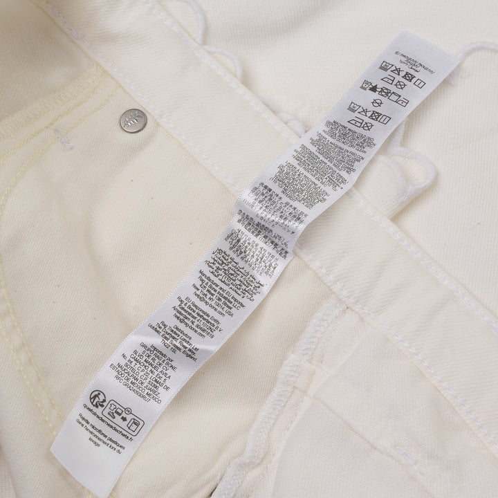 rag & bone Nolan Shorts in ivory white denim with scalloped hem, self-tie drawstring waist, and silver-tone rivets, front view