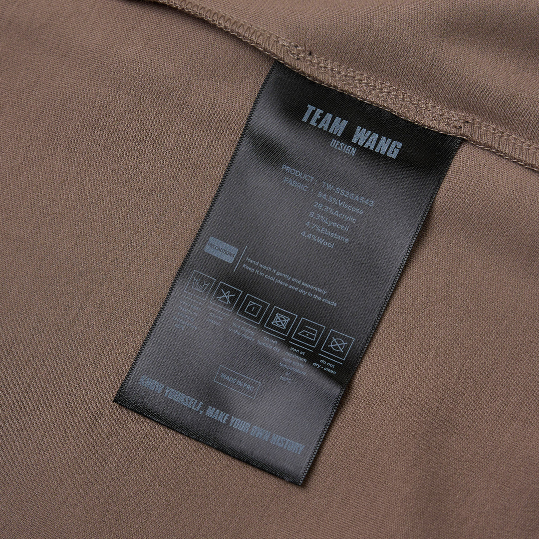 TEAM WANG design Reset Fitted Tee in black, featuring a tonal centre-front vertical seam, crew neckline, and short cap sleeves, displayed flat on a white background