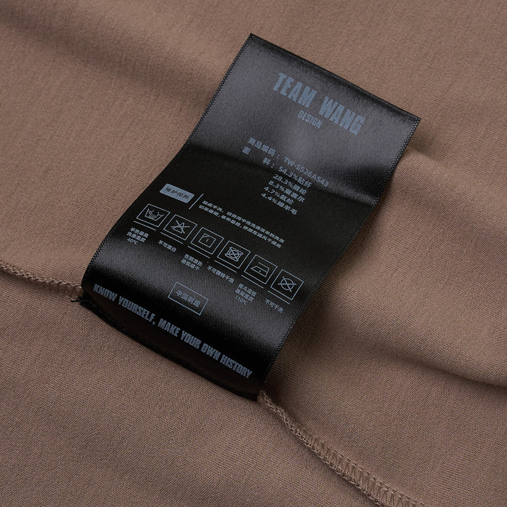 TEAM WANG design Reset Fitted Tee in black, featuring a tonal centre-front vertical seam, crew neckline, and short cap sleeves, displayed flat on a white background