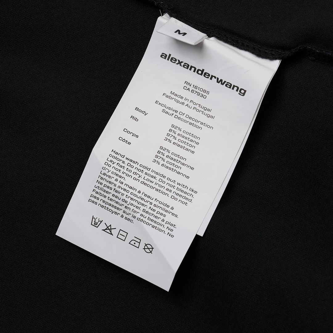 Alexander Wang white fitted crew-neck tee with hotfix crystal 'alexanderwang' logo text arranged in a radiating pinwheel sunburst pattern across the chest