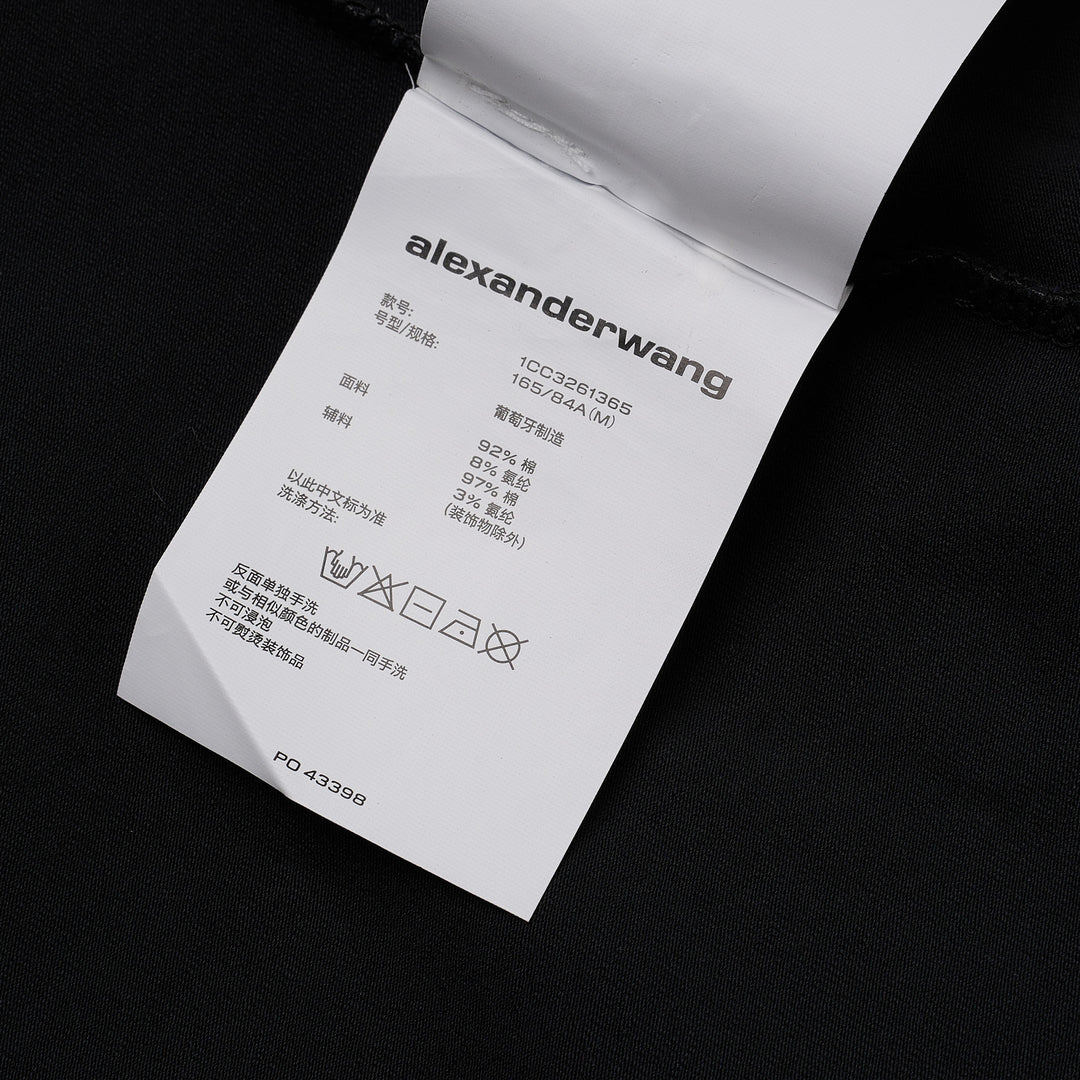 Alexander Wang white fitted crew-neck tee with hotfix crystal 'alexanderwang' logo text arranged in a radiating pinwheel sunburst pattern across the chest
