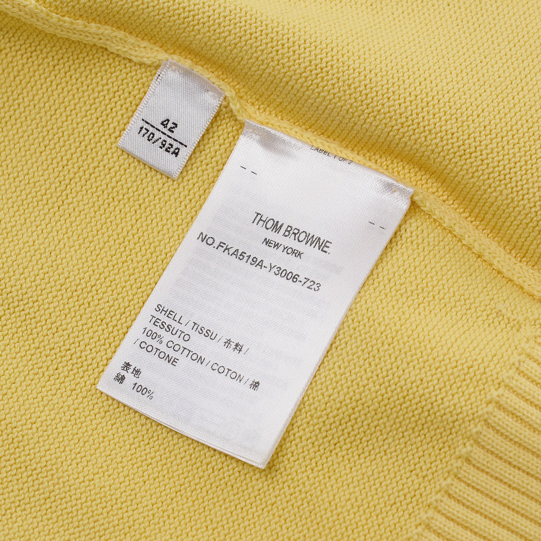 Thom Browne Short Sleeve Intarsia Knit Tee in baby pink with signature 4-bar cream stripe on the sleeve and contrast cream crew neckline, front view