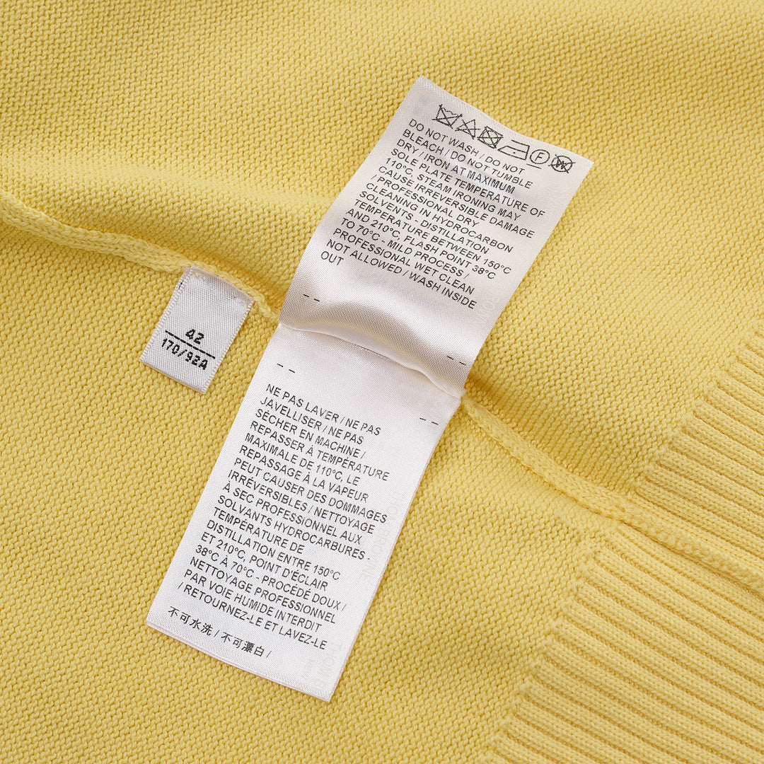 Thom Browne Short Sleeve Intarsia Knit Tee in baby pink with signature 4-bar cream stripe on the sleeve and contrast cream crew neckline, front view