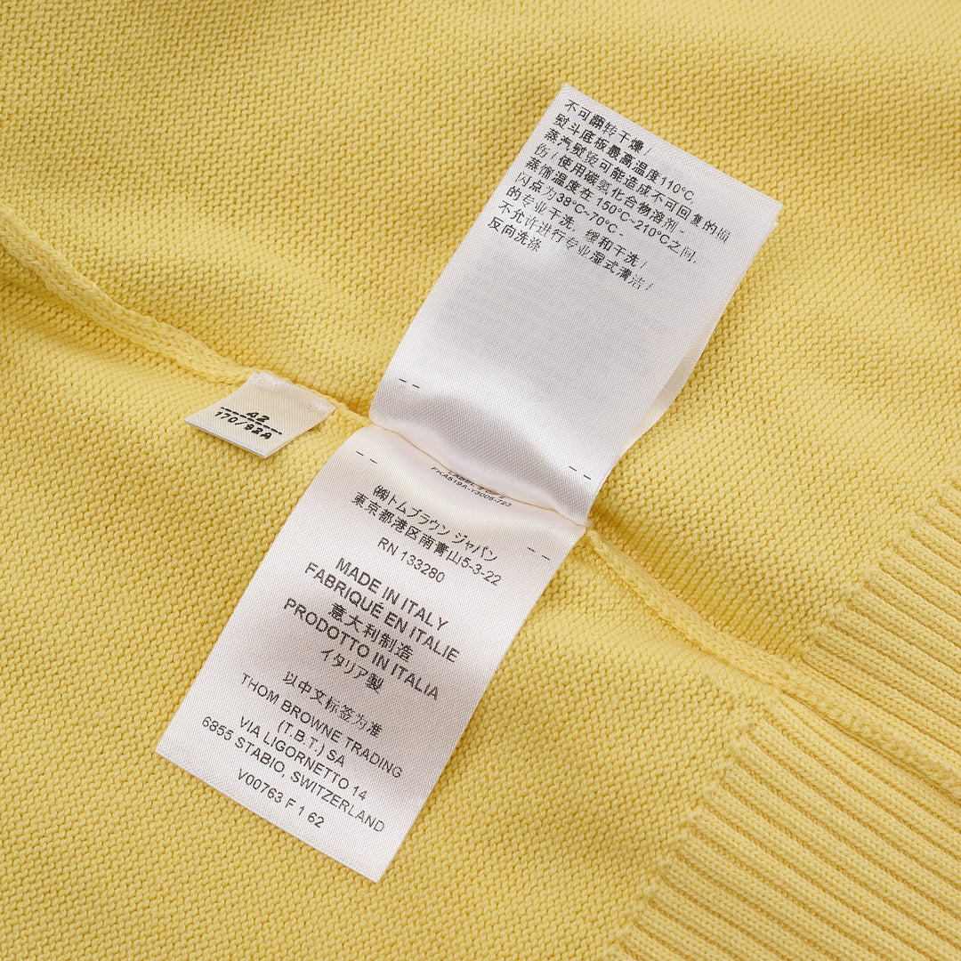 Thom Browne Short Sleeve Intarsia Knit Tee in baby pink with signature 4-bar cream stripe on the sleeve and contrast cream crew neckline, front view