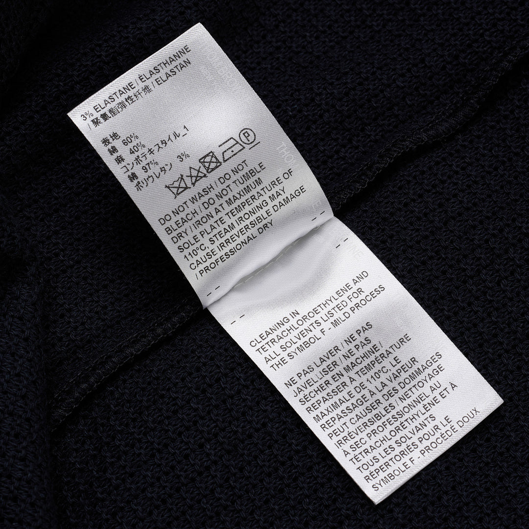 Thom Browne navy open-knit relaxed short sleeve tee with red, white, and blue striped ribbed crew neck collar and chest patch pocket