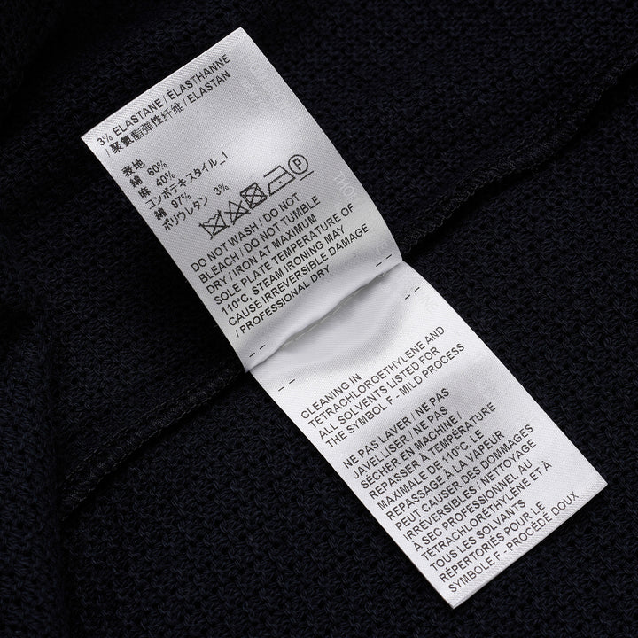Thom Browne navy open-knit relaxed short sleeve tee with red, white, and blue striped ribbed crew neck collar and chest patch pocket