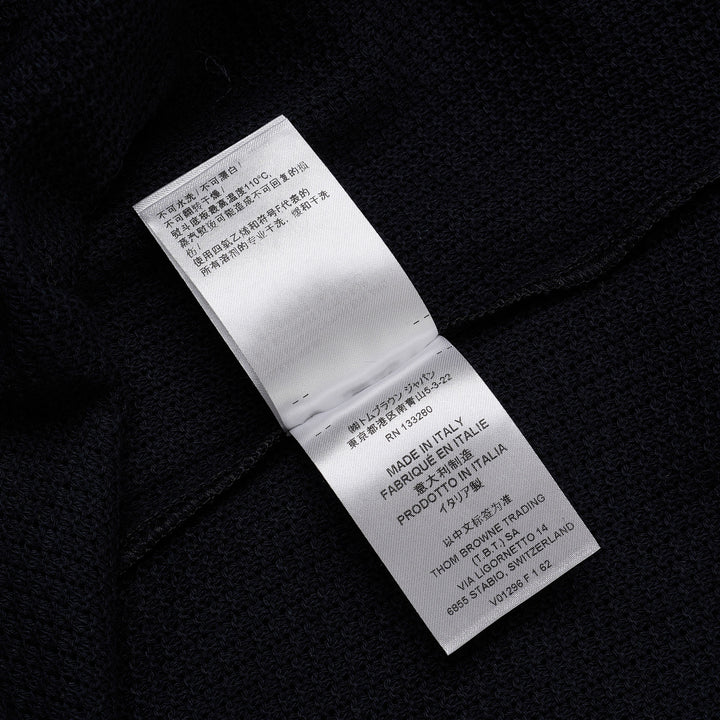 Thom Browne navy open-knit relaxed short sleeve tee with red, white, and blue striped ribbed crew neck collar and chest patch pocket
