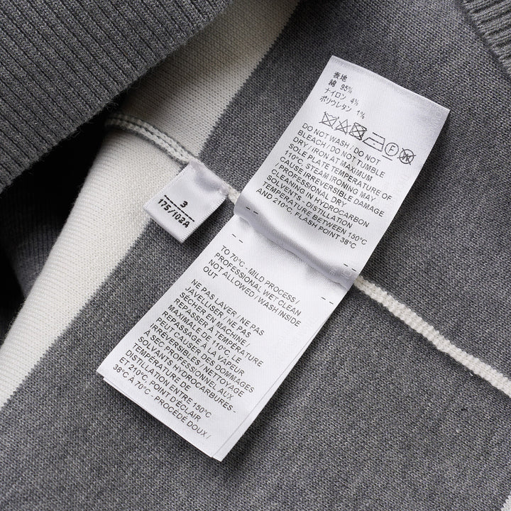 Thom Browne rugby stripe zip-up hoodie in heathered grey and white with signature four-bar stripe on sleeve, full-length zip, drawstring hood, and ribbed hem