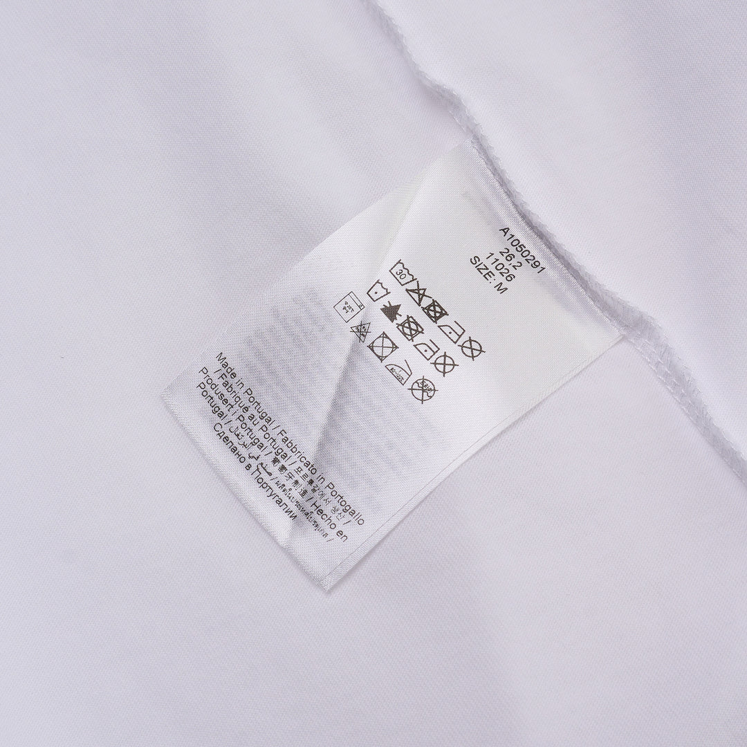 Ganni white cotton jersey tee featuring a large strawberry and daisy graphic print on the back with 'Have a nice day! Please recycle' slogan and Ganni logo in blue