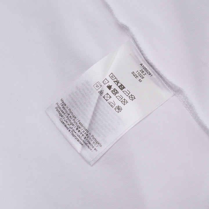Ganni white cotton jersey tee featuring a large strawberry and daisy graphic print on the back with 'Have a nice day! Please recycle' slogan and Ganni logo in blue