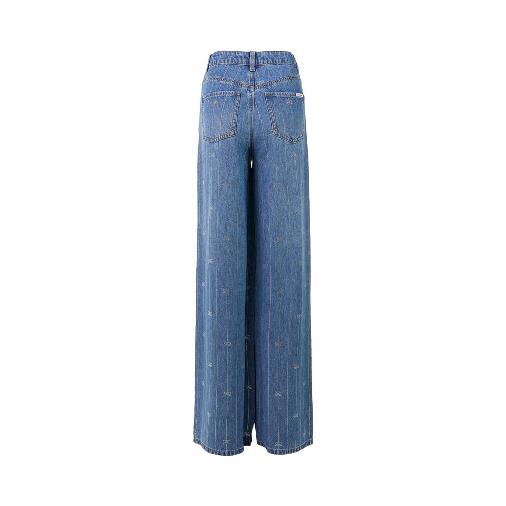Self-Portrait light blue wide-leg jeans with rhinestone pinstripes and embroidered bow motifs on a white background