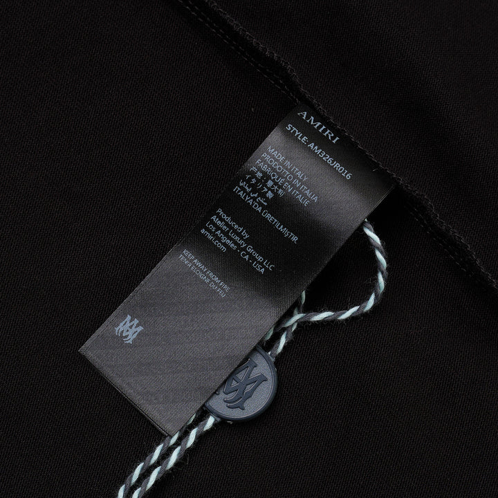 Amiri Crystal Gradient Hollywood Tee in black, featuring an oversized fit and a shimmering blue crystal-embellished 'Amiri Hollywood' graphic across the chest