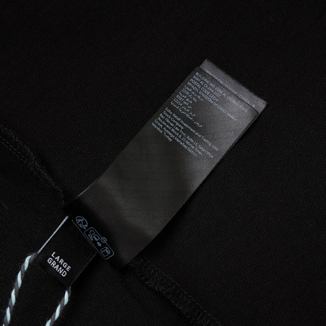 Amiri Arts District Skate Tee in black with tonal embossed chest branding, oversized silhouette and ribbed crewneck, front view
