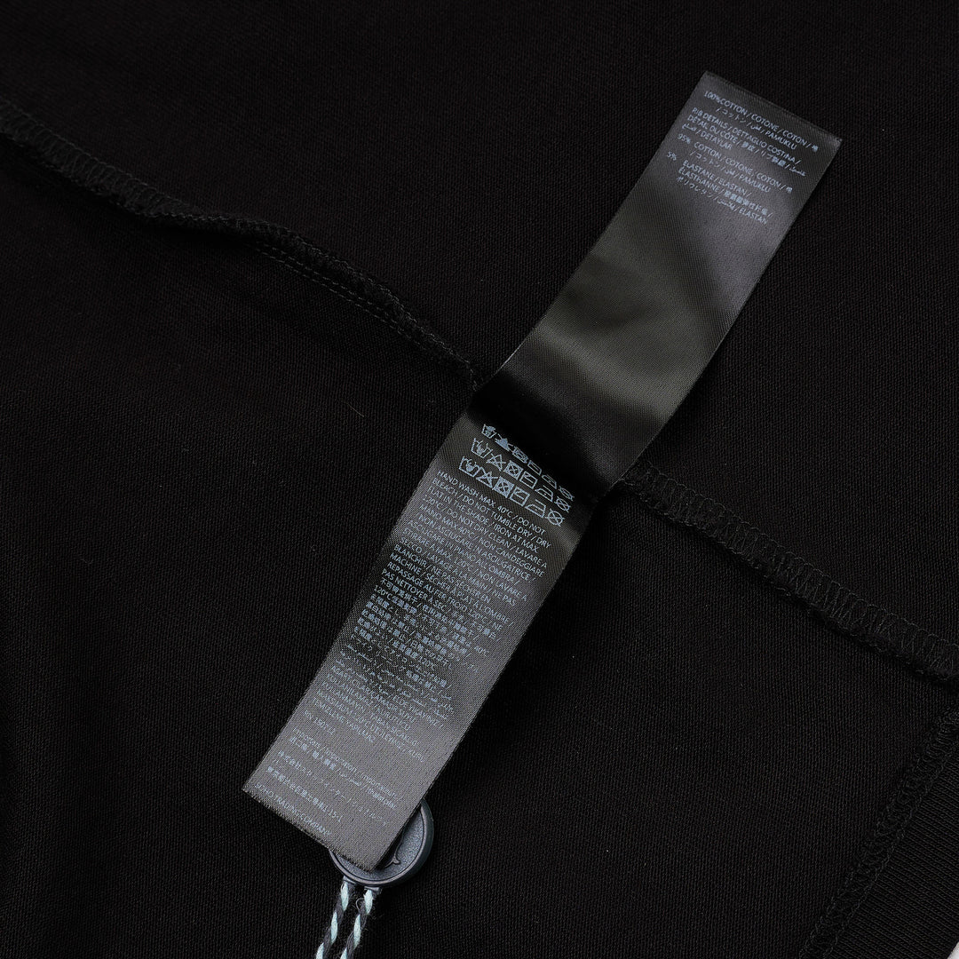 Amiri Arts District Skate Tee in black with tonal embossed chest branding, oversized silhouette and ribbed crewneck, front view