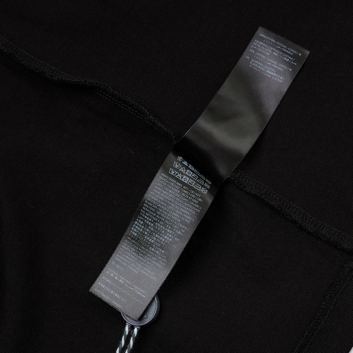 Amiri Arts District Skate Tee in black with tonal embossed chest branding, oversized silhouette and ribbed crewneck, front view