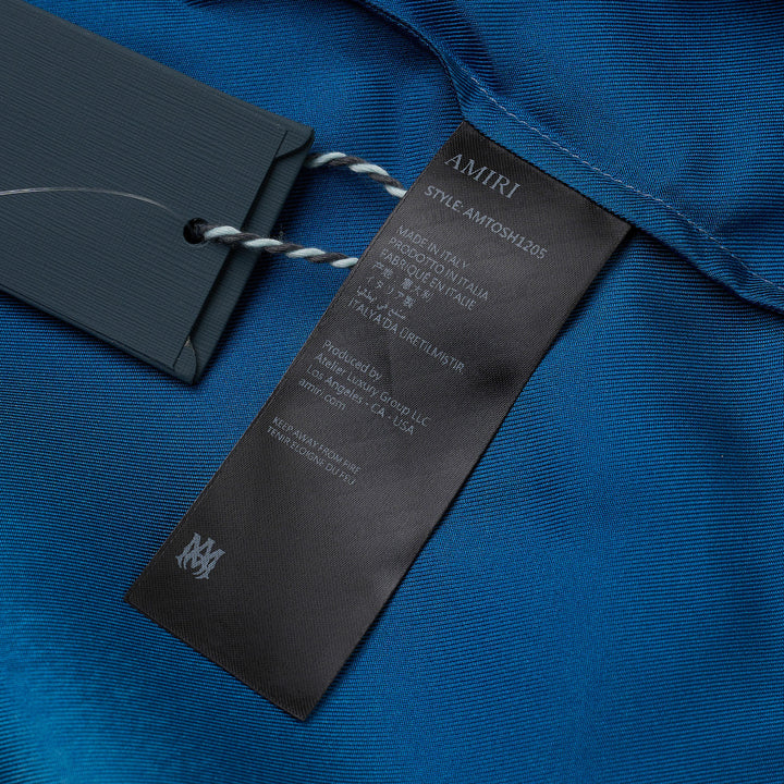 Amiri Arts District Short Sleeve Camp Shirt in blue ombré with tonal logo graphic print and mother-of-pearl buttons