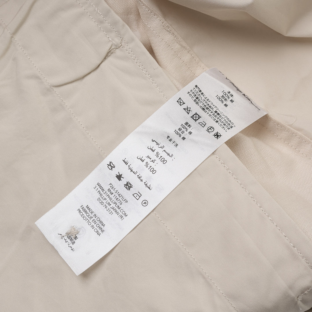 3.1 Phillip Lim Double Waistband Poplin Pants in ecru, featuring a wide-leg silhouette, drawstring waistband, and thigh patch pockets