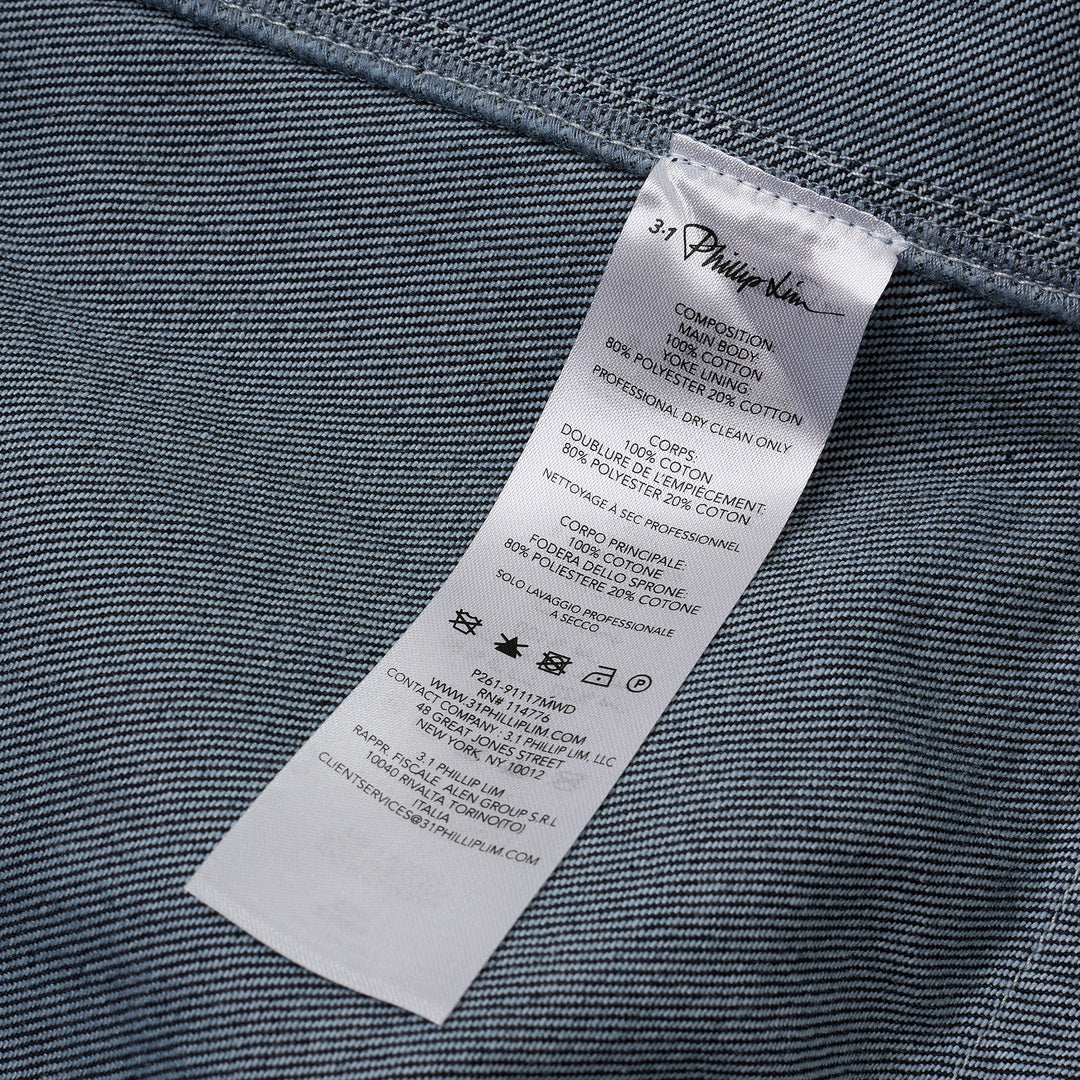 3.1 Phillip Lim Trapeze Midi Denim Shirt Dress in dark indigo with contrast topstitching, snap-button placket, decorative chest pockets, and A-line silhouette