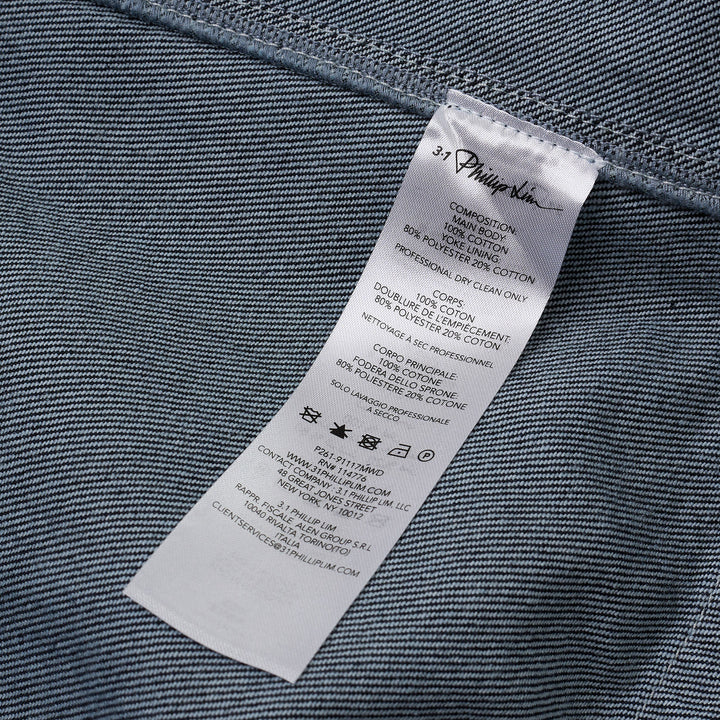 3.1 Phillip Lim Trapeze Midi Denim Shirt Dress in dark indigo with contrast topstitching, snap-button placket, decorative chest pockets, and A-line silhouette
