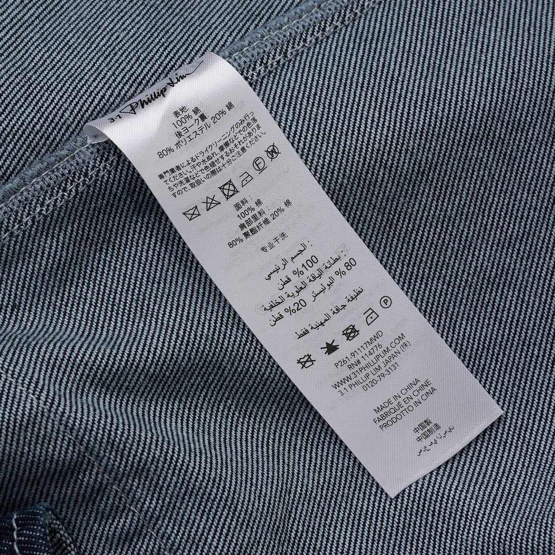 3.1 Phillip Lim Trapeze Midi Denim Shirt Dress in dark indigo with contrast topstitching, snap-button placket, decorative chest pockets, and A-line silhouette