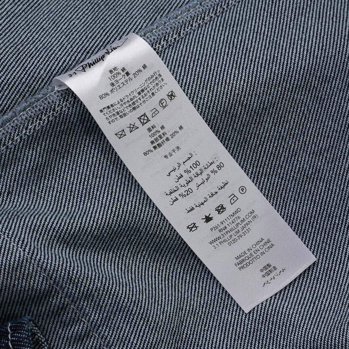 3.1 Phillip Lim Trapeze Midi Denim Shirt Dress in dark indigo with contrast topstitching, snap-button placket, decorative chest pockets, and A-line silhouette