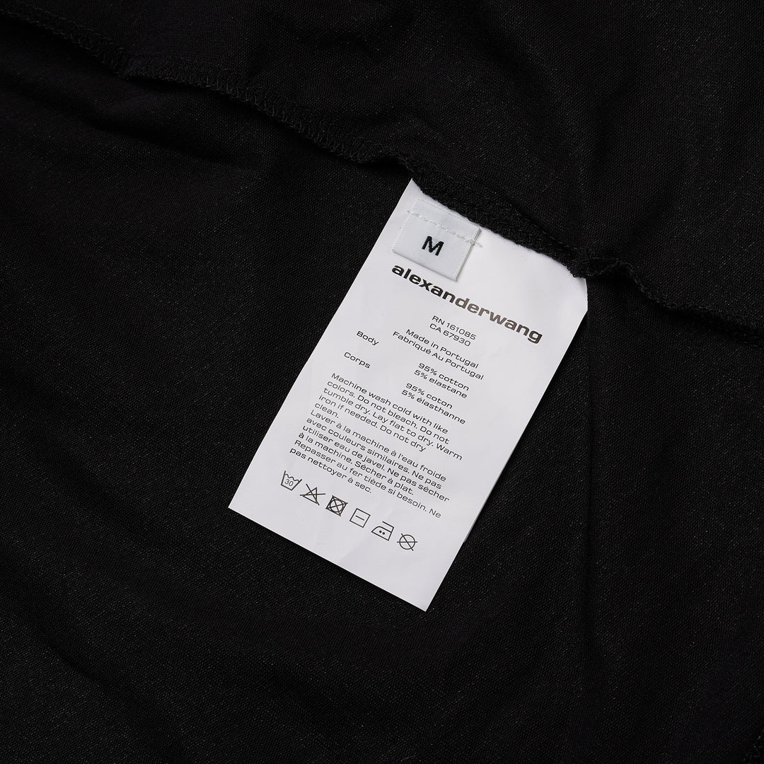 Alexander Wang black twisted bust layered mini dress with ruched bodice, cap sleeves, and double-hem finish, displayed on a white background