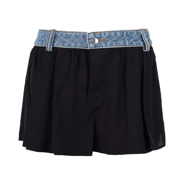 Alexander Wang mid-rise shorts with acid-wash denim waistband and pleated black fabric body, featuring silver snap button and contrast orange topstitching