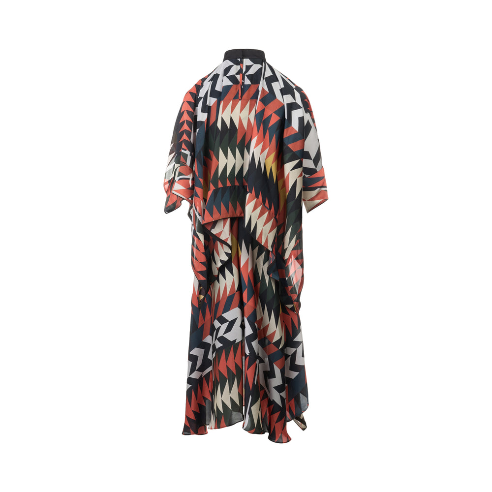 sacai x A.P.C. Quilts Dress in a geometric triangle and chevron print of terracotta, black, white, olive, and gold, featuring a mock neck, contrast chest band, kimono sleeves, and an asymmetric draped hem - view 2