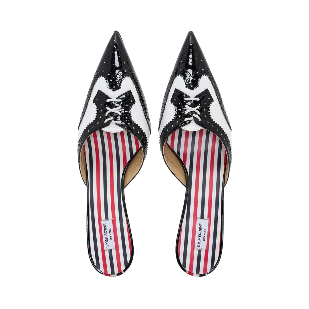 Thom Browne black and white patent leather brogue mule with sculptural flared kitten heel and pointed toe, featuring perforated detailing and signature striped insole lining - view 4