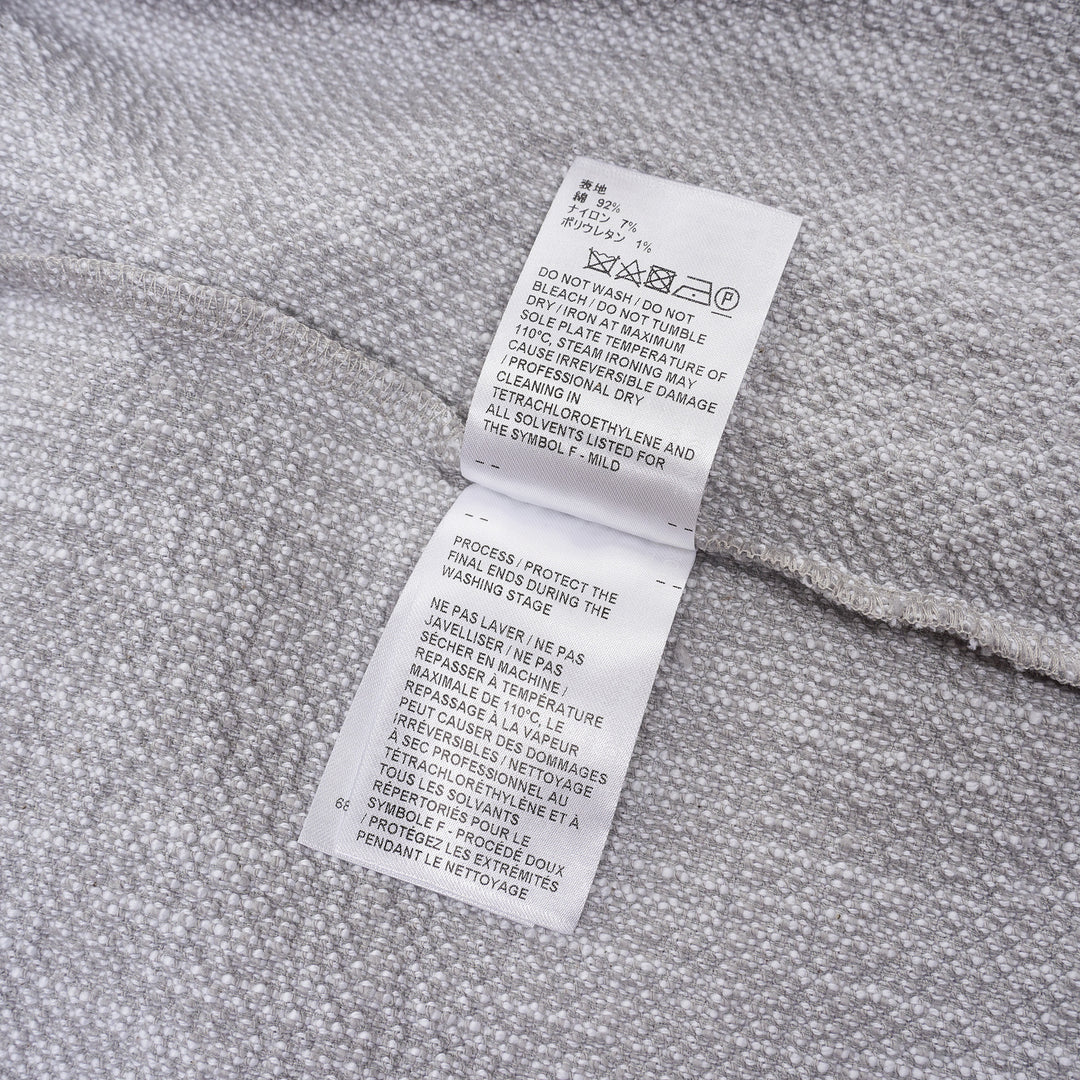 Thom Browne heather grey textural knit short sleeve tee with red, white, and blue striped tipping on sleeve cuffs and hem, white ribbed crew neck and hem band, and woven brand label on chest - view 4