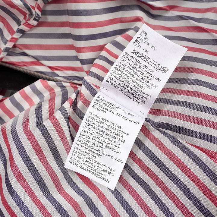 Thom Browne grey pleated mini skirt with tonal 4-bar stripe on one panel and red, white, and blue grosgrain tab at hem - view 4