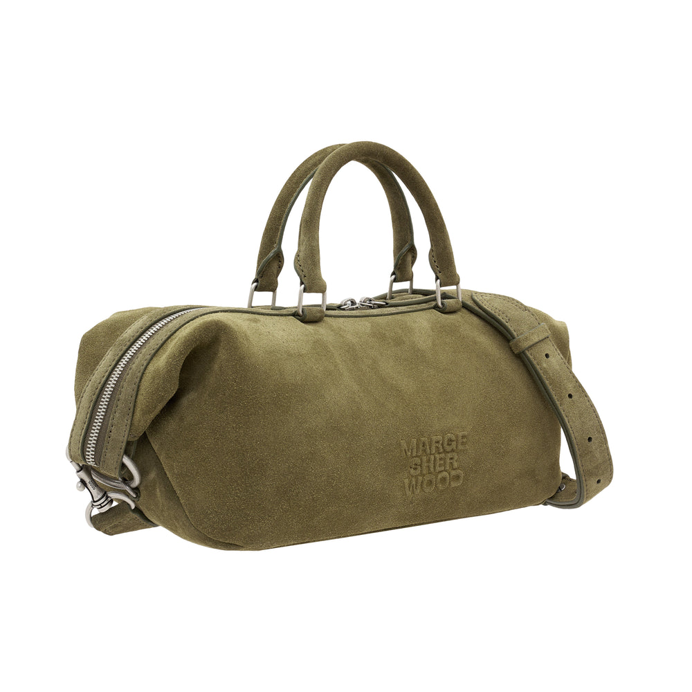 Marge Sherwood Dumpling EW Tote in olive suede with dual top handles, side zip pocket, adjustable crossbody strap, and tonal embossed logo, shown against white background - view 2