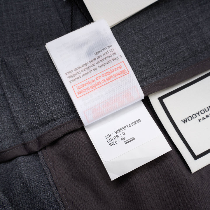 Wooyoungmi Elastic Waist Slim Pants in grey mélange fabric with ribbed knit cuffs and metal hardware detail at the waistband, front view - view 7