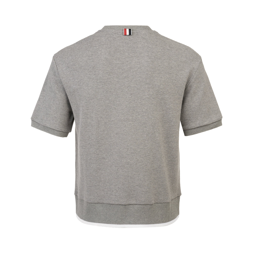 Thom Browne Short Sleeve Rib Cuff Tee in heather grey with ribbed crew neck, banded cuffs, layered contrast hem, and woven branding label at the hip - view 2