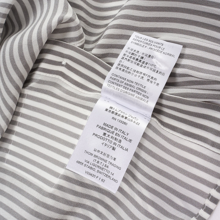 Thom Browne grey and white vertical stripe long sleeve blouse with detachable pussy-bow collar, contrast horizontal-stripe cuffs, and signature woven label patch at the hip - view 5