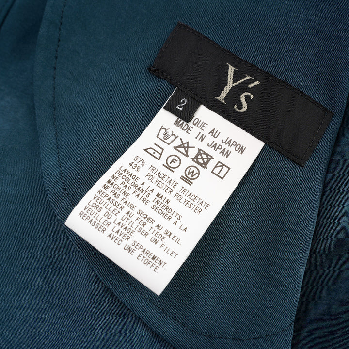 Y's teal blue gather collar shirt dress with tie neck, button front fastening, oversized patch pockets, and ribbon cuff ties, displayed flat on white background - view 3