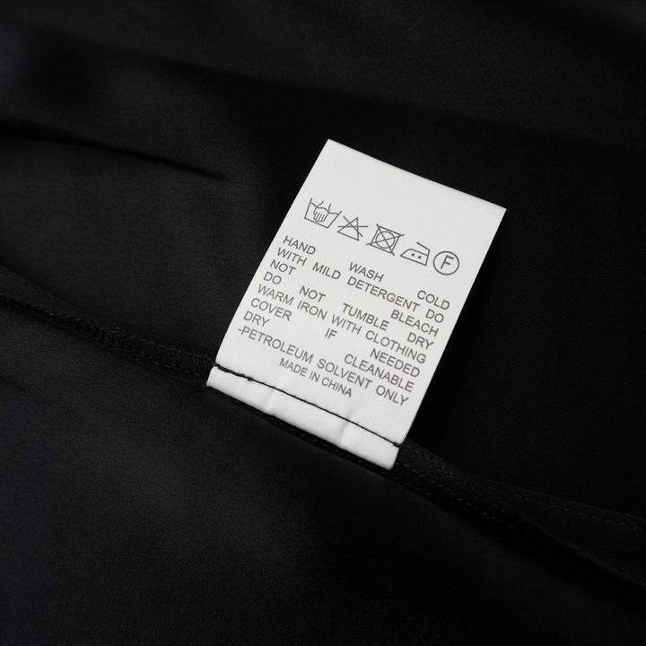Black sleeveless satin wrap top with a V-neckline, tie waist and asymmetric draped hem from Club21 Collection - view 4