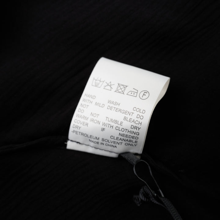 Black sleeveless halter top in crinkled silk-blend fabric with a scooped neckline and self-tie open back - view 4
