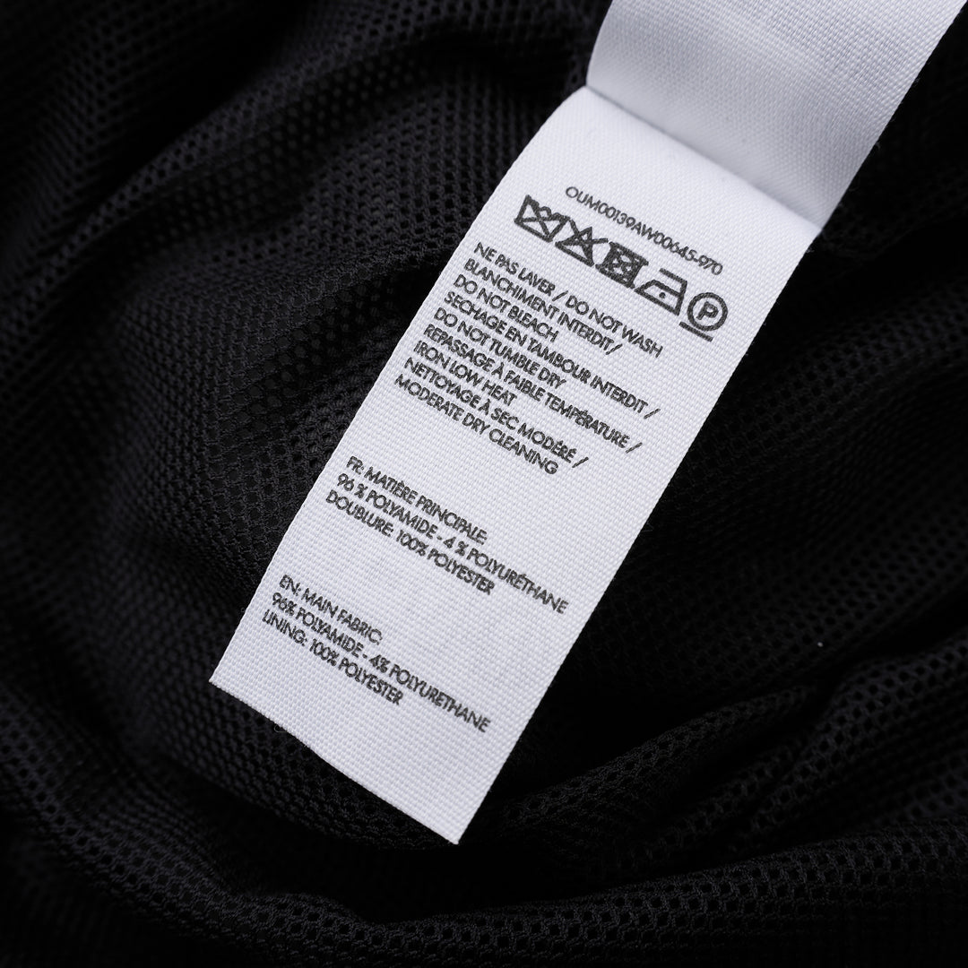 Jacquemus Le Coupe-Vent charcoal grey zip-up windbreaker with collar, elasticated cuffs and hem, and embroidered gold monogram on the chest - view 3