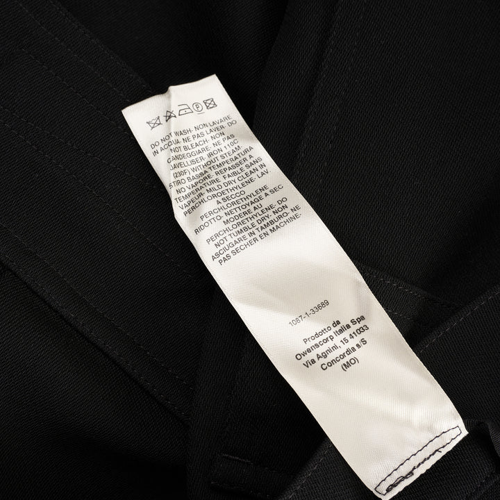 Rick Owens Stefan Cargo Twisted Shorts in black, featuring oversized patch pockets, raw-hem leg openings, and a silver snap button fastening at the waistband - view 4